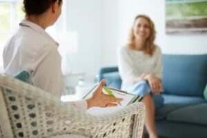Therapist speaking with client.